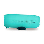 Teal DryTunes speaker lying on its side, showing the buttons and the magnetic base