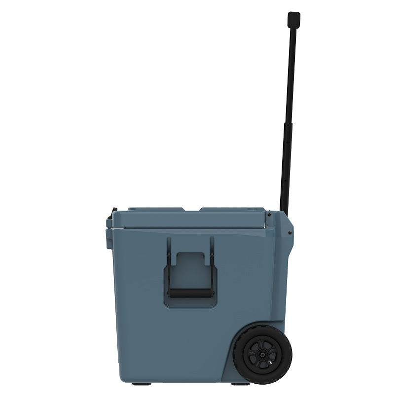 Slate-blue Cordova 50 qt wheeled cooler, side view with the telescoping handle extended