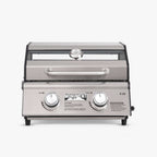Front view of a stainless two-knob tabletop grill with a window strip in the lid and a lid thermometer