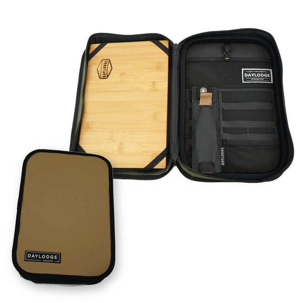 Open Daylodge Gaucho case with a bamboo cutting board inside and utensil pockets, plus a tan pouch
