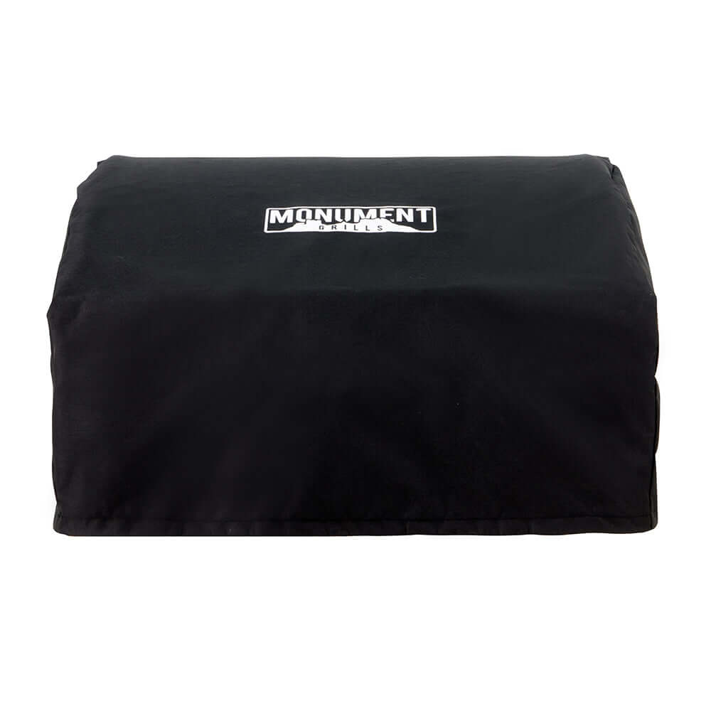 Black fitted grill cover with a white Monument logo, seen at an angle