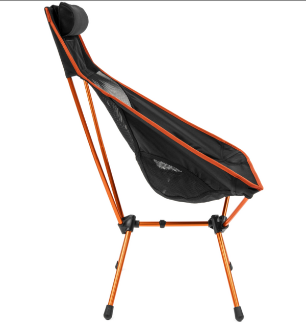 Side view of the tall-back camp chair showing the reclined black seat, head pillow and orange frame legs